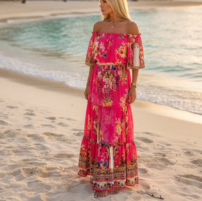 PAPARAZZI robe longue 2134 maxi fuchsia chic imprimé floral et baroque, style épaules dénudées (off-shoulder), coupe fluide élégante et tendance, parfaite pour une allure glamour habillée en toutes circonstances, tissu léger et confortable.