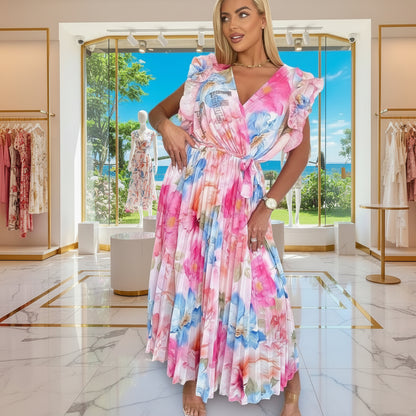 PAPARAZZI robe longue plissée à fleurs 2142  : l’élégance vaporeuse en mousseline pour vos soirées d’été, avec son décolleté en v plongeant et ses manches à volants, une pièce unique pour un look romantique et sophistiqué.