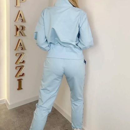 0090 PAPARAZZI ensemble jogging bleu ciel paparazzi luxe avec ailes en strass argentés et cristaux scintillants coupe slim fit glamour tendance