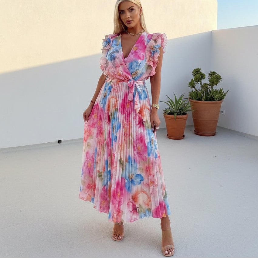 PAPARAZZI robe longue plissée à fleurs 2142  : l’élégance vaporeuse en mousseline pour vos soirées d’été, avec son décolleté en v plongeant et ses manches à volants, une pièce unique pour un look romantique et sophistiqué.