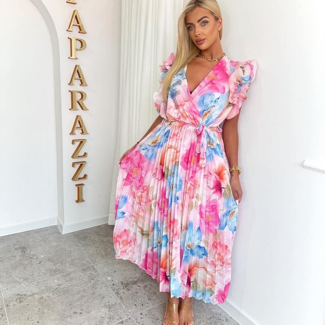 PAPARAZZI robe longue plissée à fleurs 2142  : l’élégance vaporeuse en mousseline pour vos soirées d’été, avec son décolleté en v plongeant et ses manches à volants, une pièce unique pour un look romantique et sophistiqué.