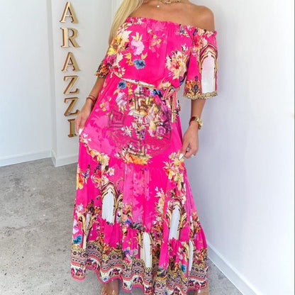 PAPARAZZI robe longue 2134 maxi fuchsia chic imprimé floral et baroque, style épaules dénudées (off-shoulder), coupe fluide élégante et tendance, parfaite pour une allure glamour habillée en toutes circonstances, tissu léger et confortable.