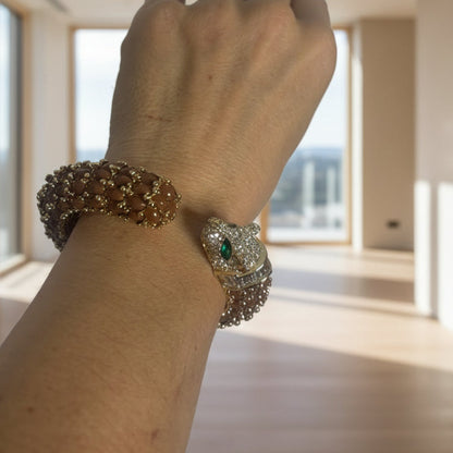 NIIKI PARIS Jonc leo noir et marron à une tête ( poignet 17 cm) Tout les bijoux NIIKI indisponibles sont en précommande dans un délai de 15 jours ouvrables voir en privé avec Laetitia .